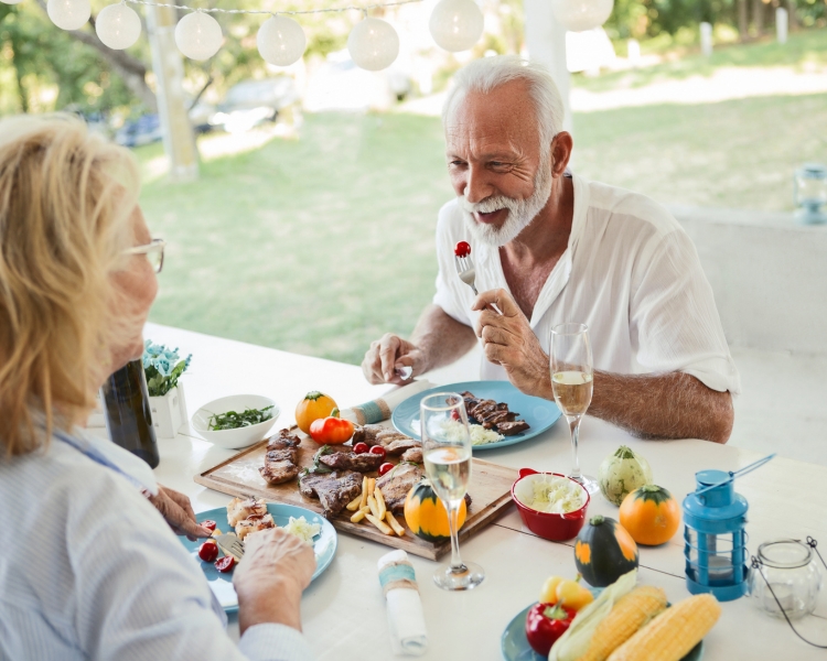 Seniors Enjoying being served in dining room